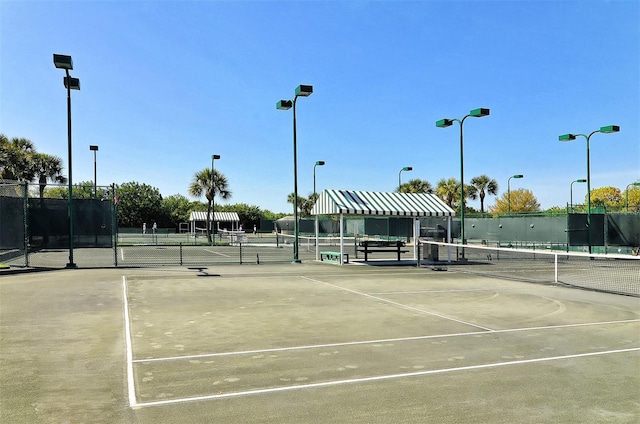 view of tennis court with fence