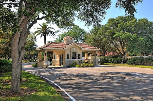 mediterranean / spanish-style house with a tiled roof and stucco siding