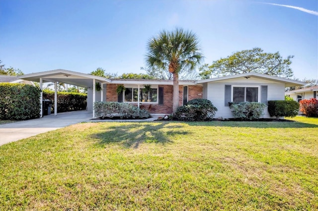 ranch-style house with driveway, brick siding, an attached carport, and a front yard