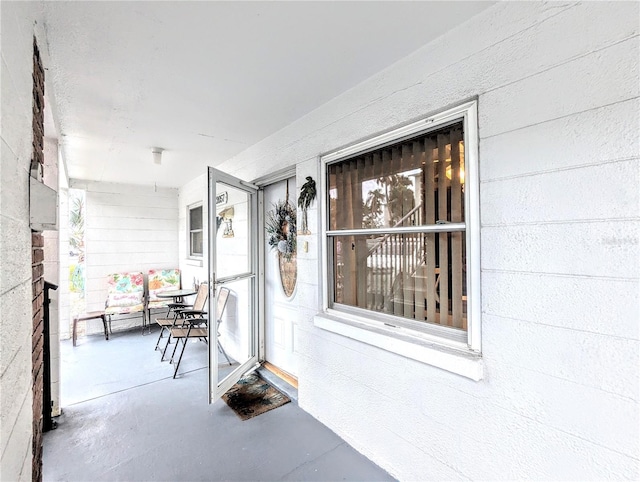 entrance to property with concrete block siding