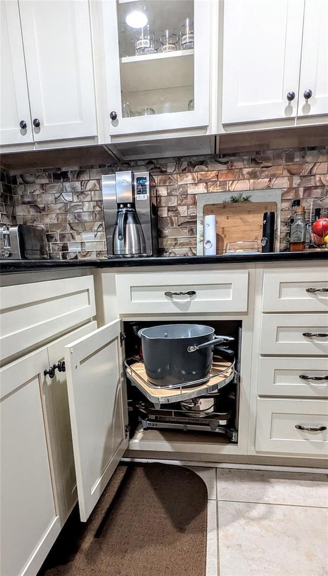 2057 Sunset Dr Unit G1, Bradenton, FL 34207 - bar featuring dark tile patterned flooring and decorative backsplash