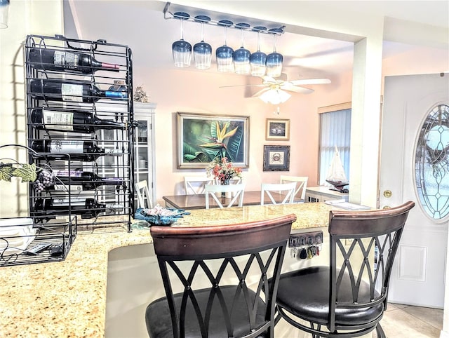 2057 Sunset Dr Unit G1, Bradenton, FL 34207 - dining area with ceiling fan and light tile patterned floors