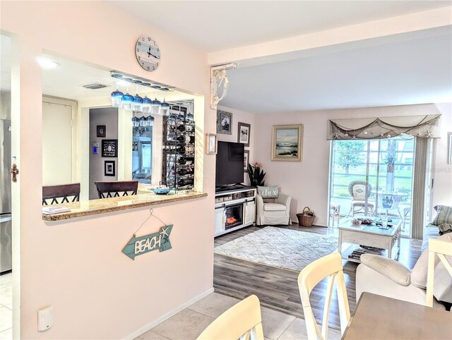2057 Sunset Dr Unit G1, Bradenton, FL 34207 - living room with light tile patterned floors and visible vents