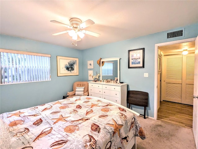 2057 Sunset Dr Unit G1, Bradenton, FL 34207 - bedroom featuring light colored carpet, visible vents, ceiling fan, and baseboards