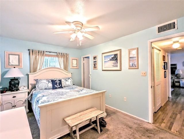 2057 Sunset Dr Unit G1, Bradenton, FL 34207 - bedroom featuring dark colored carpet, a ceiling fan, visible vents, and baseboards