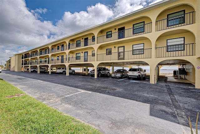 view of building exterior featuring parking