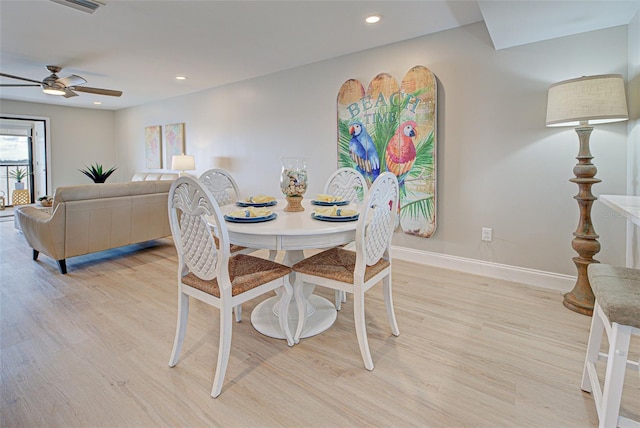 dining space with baseboards, recessed lighting, a ceiling fan, and light wood-style floors