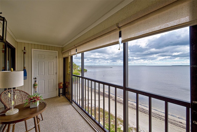 balcony featuring a water view