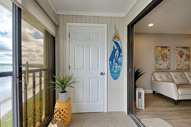 interior space featuring wood finished floors and baseboards