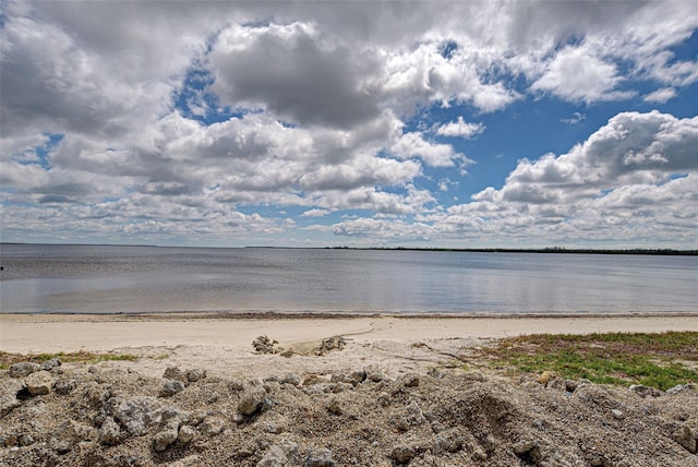 property view of water featuring a beach view