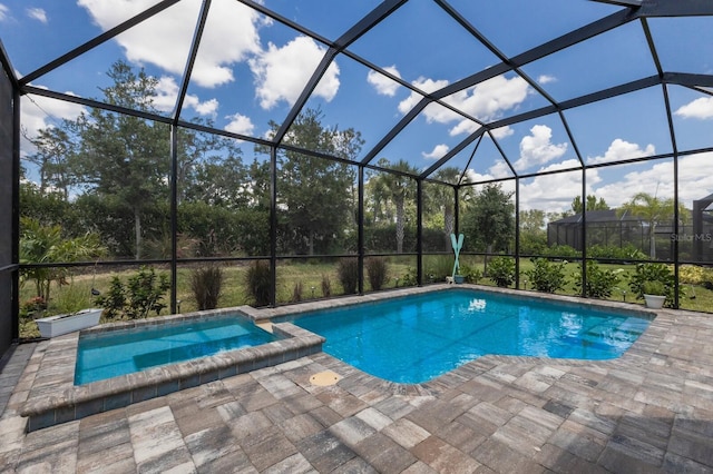 view of swimming pool with a patio and a lanai