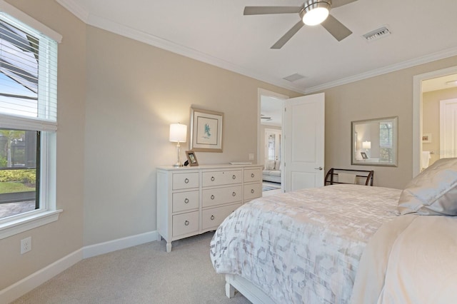 bedroom with visible vents, crown molding, light carpet, and baseboards