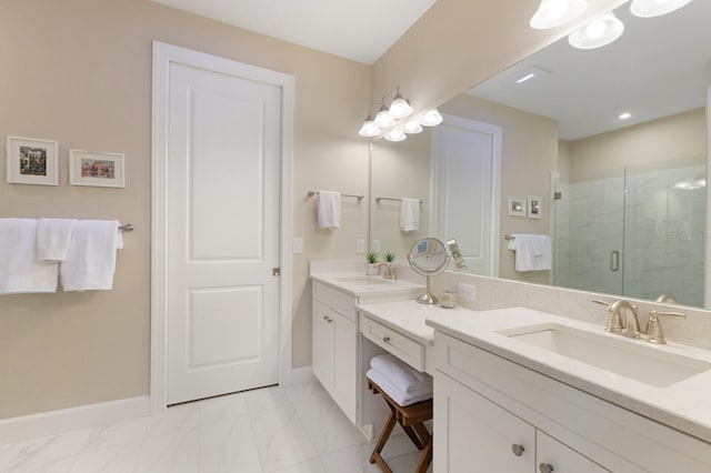 full bathroom featuring a stall shower, vanity, and baseboards