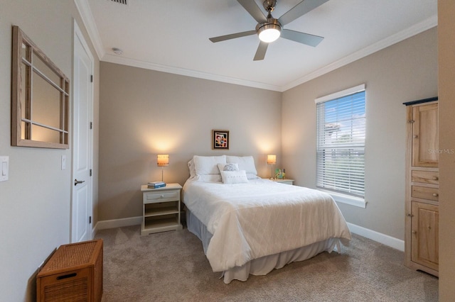 bedroom featuring carpet floors, ornamental molding, a ceiling fan, and baseboards