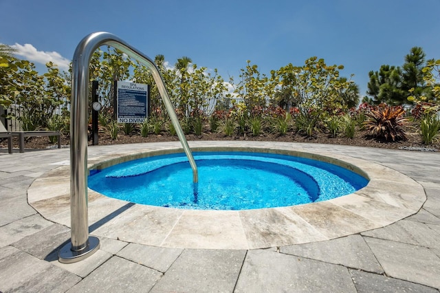 view of pool featuring fence