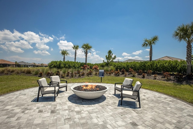 view of patio / terrace featuring an outdoor fire pit