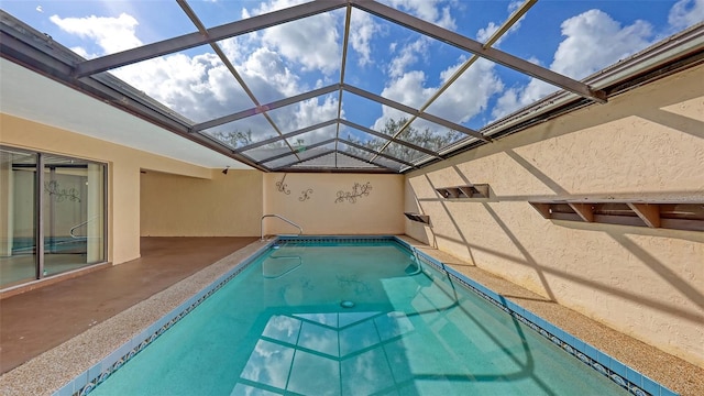 outdoor pool with a lanai and a patio