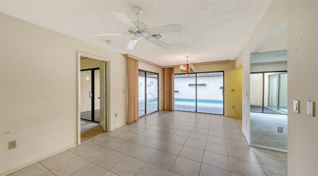 spare room featuring light tile patterned floors, light carpet, a textured ceiling, and ceiling fan with notable chandelier