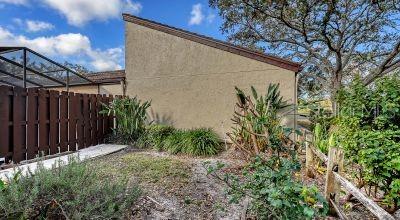 3692 Glen Oaks Manor Dr, Sarasota, FL 34232 - view of side of property with stucco siding