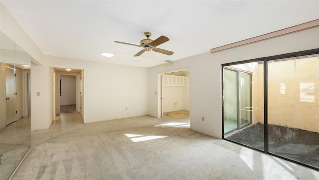 3692 Glen Oaks Manor Dr, Sarasota, FL 34232 - unfurnished bedroom featuring light colored carpet, ceiling fan, and access to exterior
