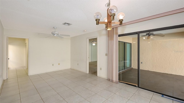 3692 Glen Oaks Manor Dr, Sarasota, FL 34232 - spare room featuring ceiling fan, a textured ceiling, a chandelier, and light tile patterned flooring