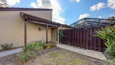 3692 Glen Oaks Manor Dr, Sarasota, FL 34232 - view of side of property with stucco siding