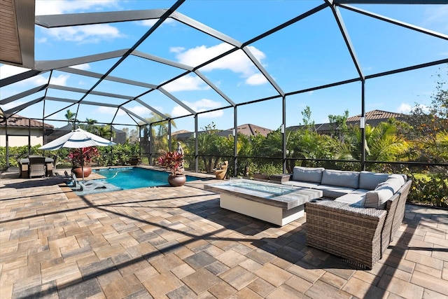 pool with a lanai, a patio area, and an outdoor hangout area