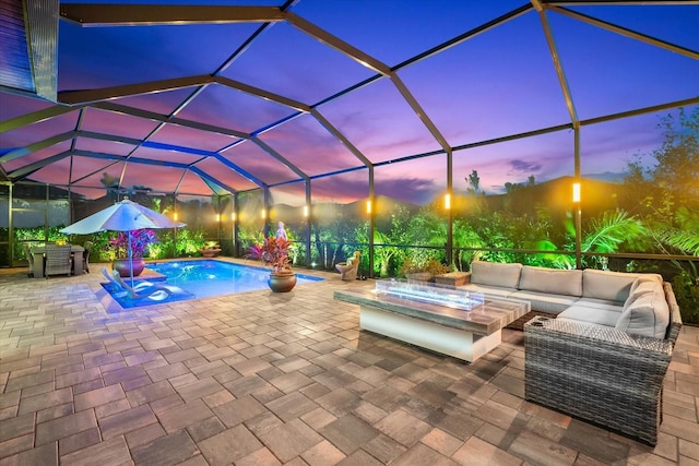 pool with a lanai, a patio area, and outdoor lounge area