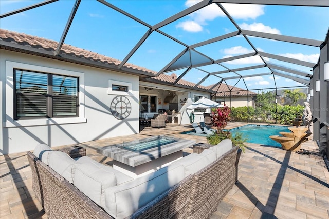 exterior space featuring an outdoor pool, ceiling fan, a lanai, and an outdoor living space