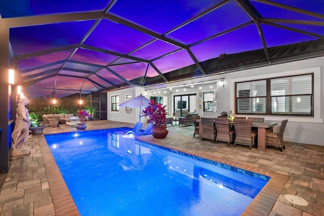 outdoor pool with a patio, outdoor dining area, outdoor lounge area, and glass enclosure