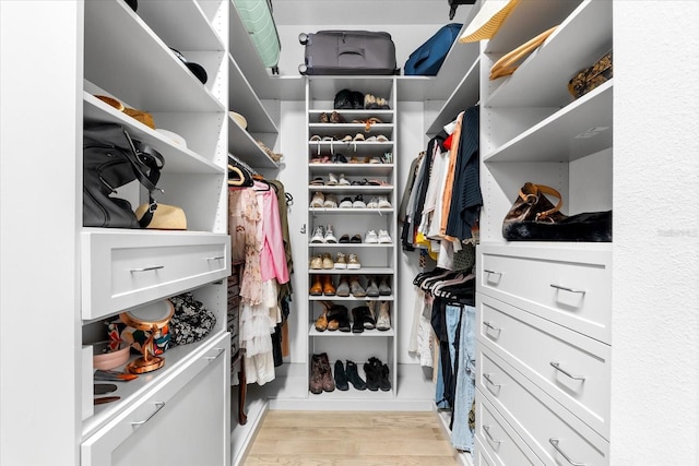 spacious closet with light wood-style flooring