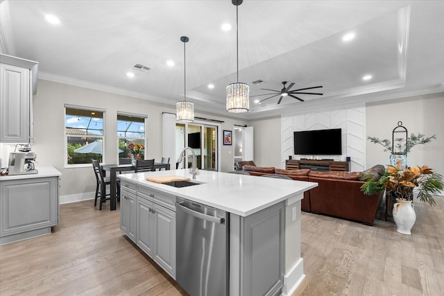 kitchen with visible vents, dishwasher, gray cabinetry, light wood-style floors, and a sink