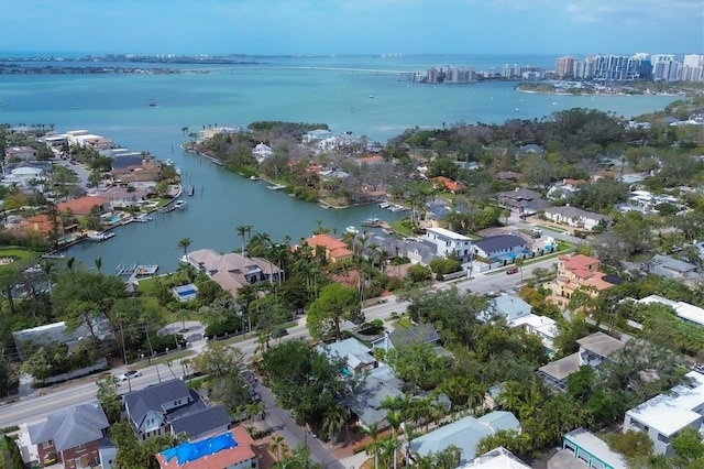 drone / aerial view with a residential view and a water view