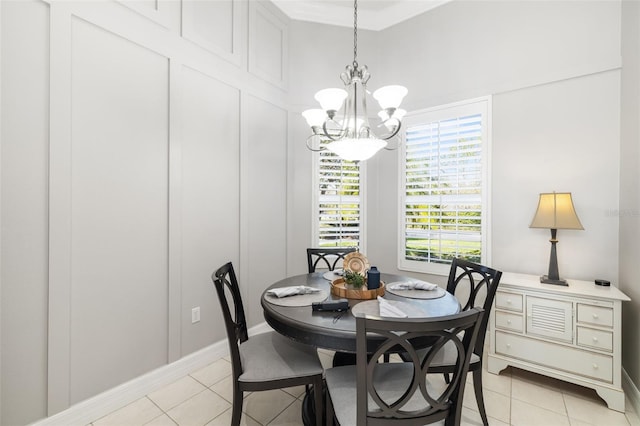 dining room with light tile patterned flooring and a notable chandelier