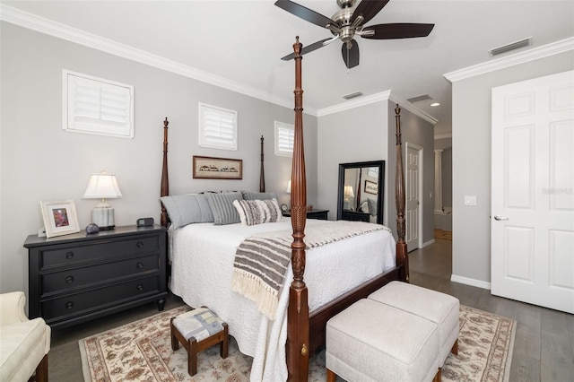 bedroom with visible vents, dark wood-type flooring, and ornamental molding