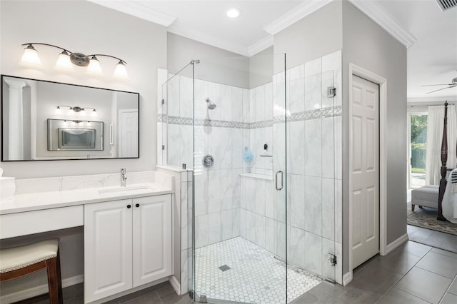 bathroom with ornamental molding, a shower stall, vanity, and tile patterned floors