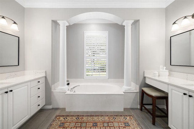 full bathroom featuring ornate columns, ornamental molding, and a bath