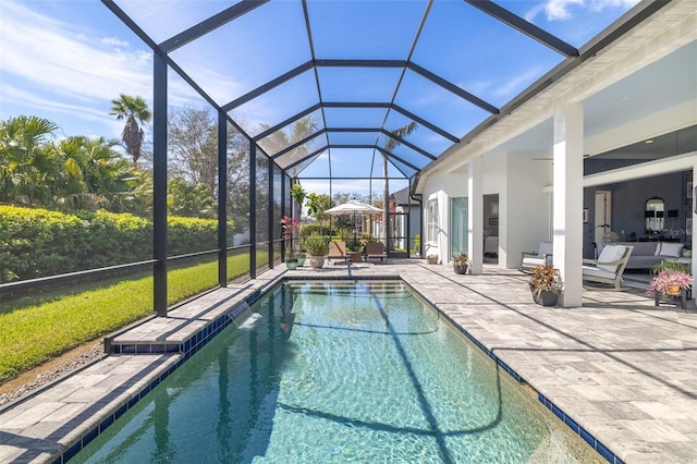 pool featuring a patio and glass enclosure