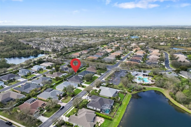 birds eye view of property featuring a water view and a residential view