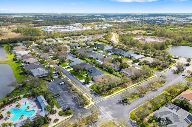 aerial view with a water view and a residential view