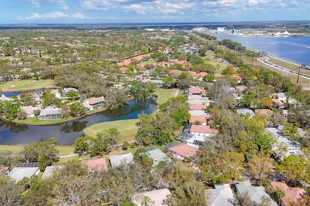 bird's eye view featuring a water view and a residential view