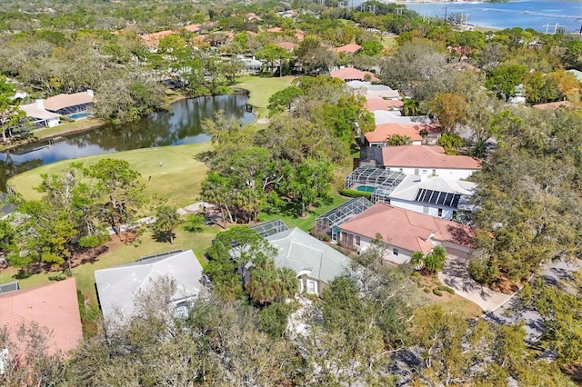 drone / aerial view with a water view and a residential view