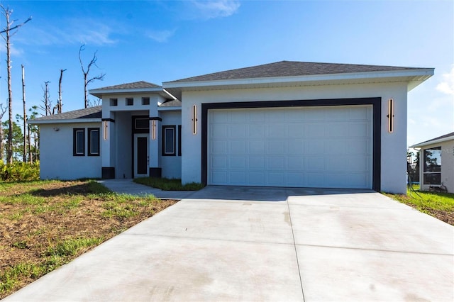 10 Mast Dr Unit 1, Placida, FL 33946 - view of front facade with stucco siding, driveway, and an attached garage