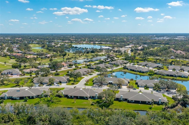 bird's eye view with a residential view and a water view