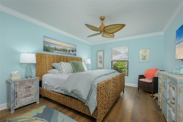 bedroom with ornamental molding, baseboards, and wood finished floors