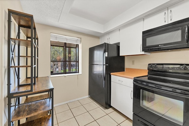 kitchen featuring light countertops, white cabinetry, light tile patterned flooring, a textured ceiling, and black appliances