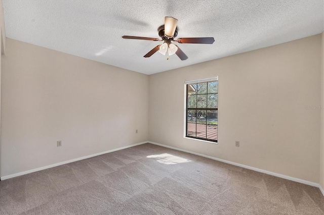 unfurnished room featuring a textured ceiling, baseboards, a ceiling fan, and light colored carpet