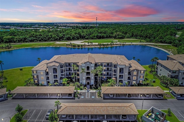 aerial view at dusk with a water view