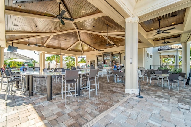 view of patio / terrace with ceiling fan, a gazebo, and outdoor dining space