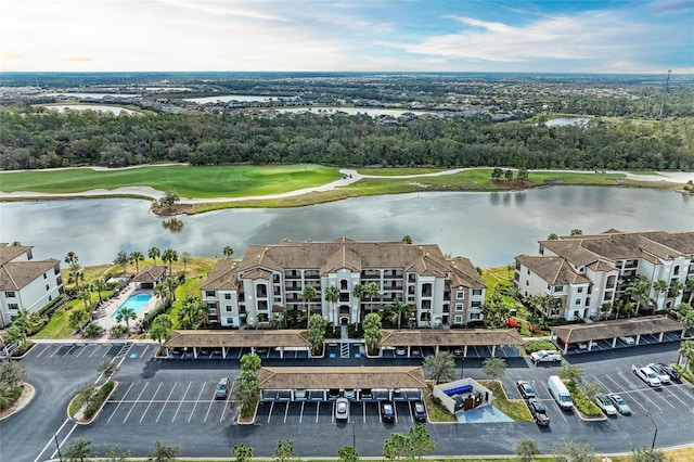 bird's eye view featuring golf course view and a water view